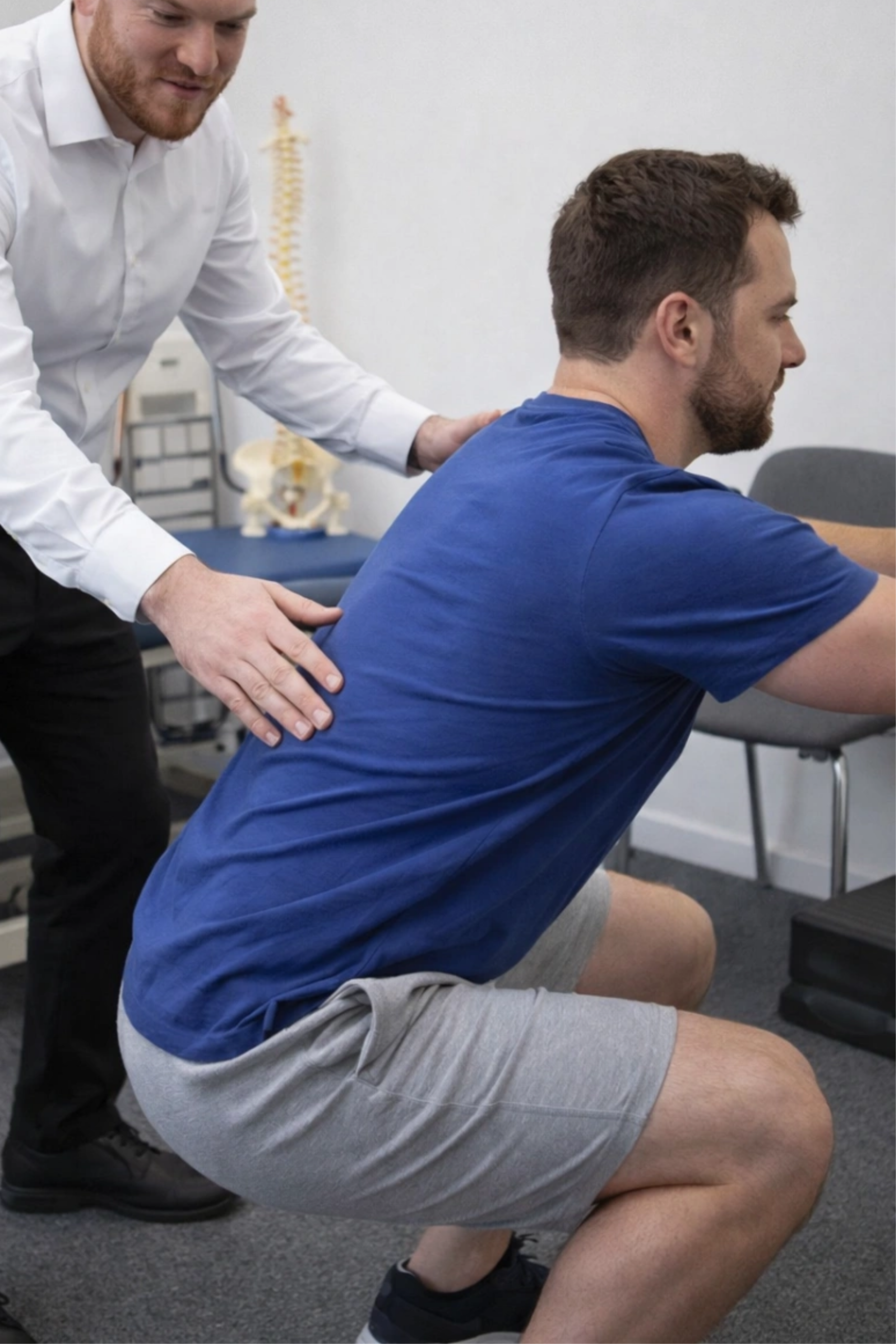 Photo of Meir training a patient to do excercises